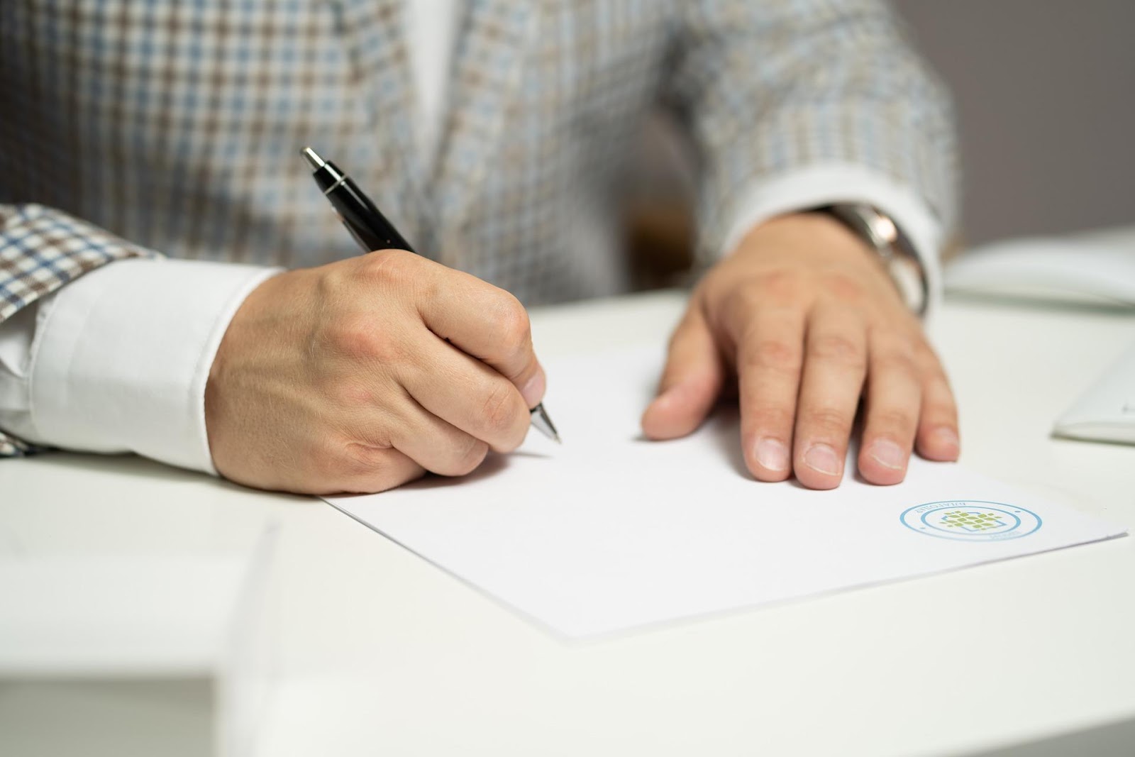 A homebuyer signing a final disclosure 