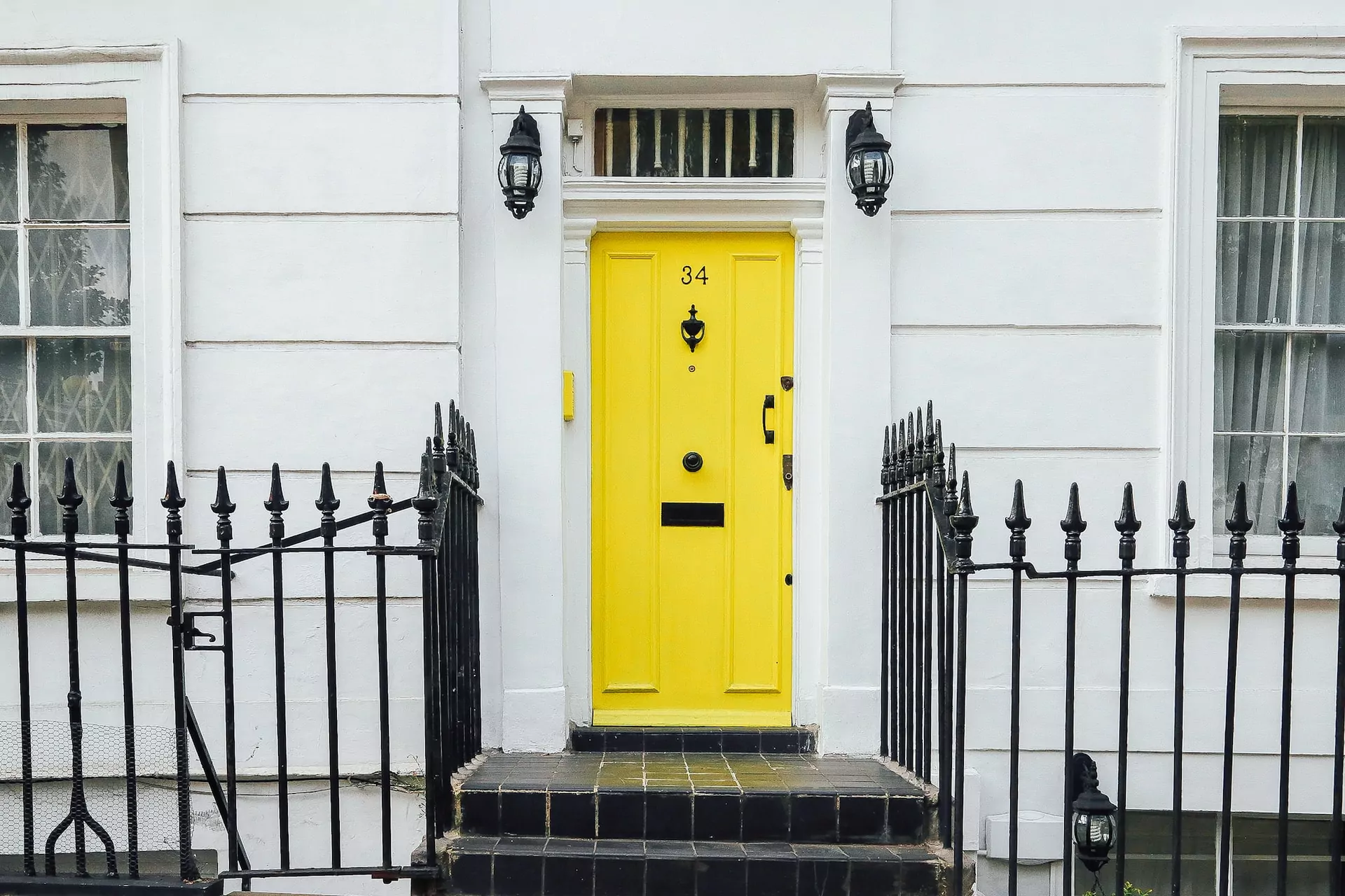 Yellow front door to a newly built home.